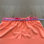 Under Armour women’s loose fit orange & pink athletic shorts large Photo 4