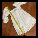Mable  white Eyelet over the shoulder sleeve dress - Size Medium. *** Refer to measurements. Perfect Easter or spring dress... even graduation coming up.  Says Medium but sleeves extends for a heavy bustted top frame. Gently warn and excellent condition. Measurements approximately 15” from armpit to armpit x 32” long. None smoking home. Priced to sell at as is condition. Don’t like my price make reasonable offer. Photo 7