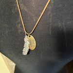 Leather Necklace with feather pendant and oval pendant that says God is Faithful Photo 1