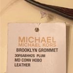 Michael Kors  Deep Chocolate Brown Tassel hang tag with Gold Hardware. Photo 7
