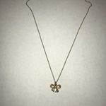 Gold bedazzled bow necklace Photo 2