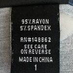 Torrid -BLUE BABYDOLL TOP-WOMENS SIZE 1X Blue babydoll top with pink flowers, 3/4 sleeves, button front, lots of stretch, 95% rayon and 5% spandex, great condition Measurements: Bust: armpit to armpit 24 inches  Length: shoulder seam to bottom  Front: 30 inches  Back:  33 inches  Photo 5