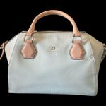 Kate Spade NEW YORK-MINT MOJITO PIPPA PARNELL STREET LEATHER SATCHEL Perfect spring bag, mint green white tan handle and crossbody strap, top zip closure, stripe print interior, inside zip pocket, inside two open pockets, amazing condition, there are two call outs, a small smudge on the bottom of the bag and a small smudge on one corner, please see the last two pictures **This bag is preowned and is being sold as is** Photo 4