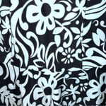 Gaviota diamante black skirted one piece with white flowers! Size undefined Photo 5