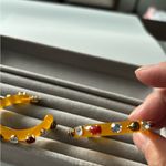 Kurt Geiger  Gold and Red Embellished Earrings Photo 2