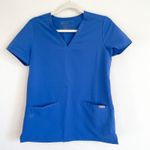 FIGS  Denim Blue Casma Three Pocket Scrub Top Photo 1