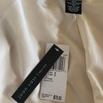 Joan Vass white coat Photo 1