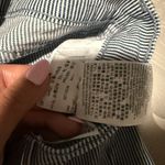 Levi's  524 Ultra Low Rise Skinny Leg Jeans with a blue and white striped pattern Photo 7