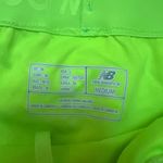 New Balance Womens  green/fluorescent yellow polka dot athletic running shorts Photo 1
