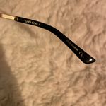 Gucci  Women's Black and Gold Sunglasses Authentic Photo 11