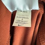 Nike yoga lux shorts rust color size x small Photo 2