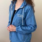 Brandy Melville blue zip up windbreaker jacket with hoodie and santa barbara embroidery Photo 4