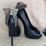 Elle bow on back of the black faux leather platform heels Size 7 M stilettos. Photo 10