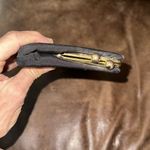 Vintage Chic Black Clutch with Gold kiss lock side Accent Photo 1