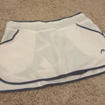 Head  white and navy tennis skirt  Photo 0
