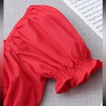 NWOT red cropped top with front tie and ruffle puff sleeve size small Photo 4