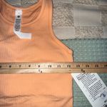 Lululemon NWT  Ebb to Street Cropped Racerback Tank
Size 4
Peach Bellini Photo 3