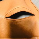 Brown patent leather diaper bag with multiple pockets and key holders Photo 10