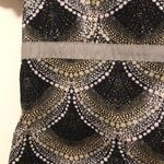 Healing Hands Women’s Black and Gold Patterned Women's Scrub Top Sz Small Photo 1