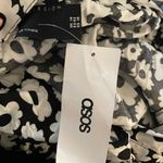 ASOS COPY -  DESIGN button through midi skirt with split in mono daisy print Photo 7