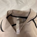 Fabletics  Beige and Black Stitch Top Photo 1