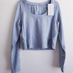 Athleta Long Sleeve Perforated Floral Reflective Sports Top Photo 1