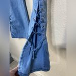 None Lightweight Women’s blue jeans, flared leg with tie details, size large Photo 2