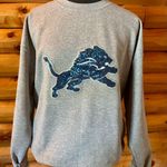 NFL Detroit lions sweater! Gray Sweatshirt with Blue Glitter Logo! Size large Photo 0