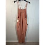 Free People  Movement Hot Shot Jumpsuit in Petal Size L. NWT Photo 3