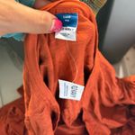 Old Navy  Rust-colored long sleeve shirt with a‎ deep scoop neckline Photo 2