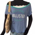 Hollister Women’s Y2K 2000s Blue Graphic Baby tee size M Photo 0