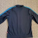 Puma Women’s vintage track jacket medium
Black zip up with blue stripe Photo 2
