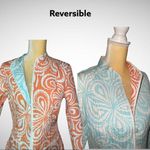 Reversible adorable jacket! From peach/white to aqua/white in one flip motion! Orange Size undefined Photo 1