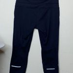 Athleta  • relay capri legging with reflective detail Photo 50