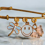 Gold Safety Pin with Charms Photo 0