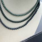 Boutique Three strand faux pearl layered necklace. Adjustable and easy. Photo 1