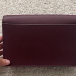 Kate Spade  Maroon Crossbody Bag with Gold Chain Strap. Photo 4