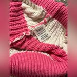 Jessica Simpson , pink and off-white striped cropped cardigan.￼ Photo 6