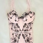 Victoria's Secret Baby pink coquette ballerina corset top with black floral and bow embroidery and ruffle details Photo 0