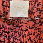 Siren Lily  Maternity Coral and Black Bow Patterned Top Photo 3