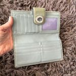 Coach  Silver/Gray and tan signature Turnlock wallet with purple lining Photo 7