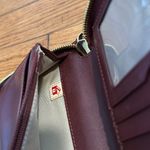 Tumi saffiano travel wallet passport holder burgundy wristlet zip around Photo 4