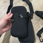 Black water bottle carrier with phone/ wallet carrier attachment Photo 1