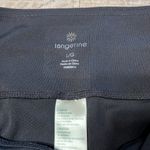 Tangerine 3:$25  capri leggings with cute cut outs down outside of each calf. Photo 3