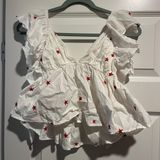 Lizard Thicket White Top With Red Starts Photo 0