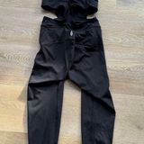 Free People NWT  Movement Black Cross-Back Onesie Jumpsuit Photo 0