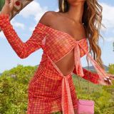 EGO LONG SLEEVE KNOTTED CUT OUT DETAIL MINI BODYCON DRESS IN PINK SPOTTY MESH Photo 0