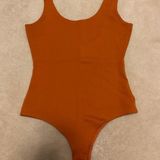 Shinestar Orange Bodysuit Photo 0
