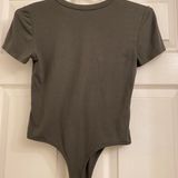 green bodysuit Photo 0