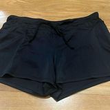 Tropical Escape  women’s black swim shorts size 10. Photo 0